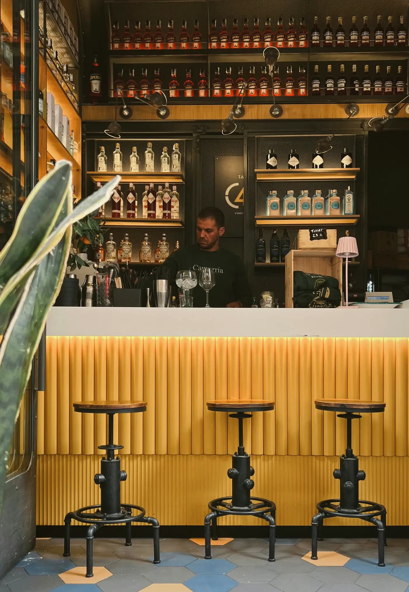 A customer paying with a gift card at a Peblla restaurant counter